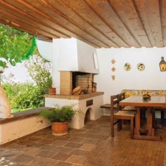 Villa in Röthis - Sitzplatz mit Kamin im UG - Amann Immobilien