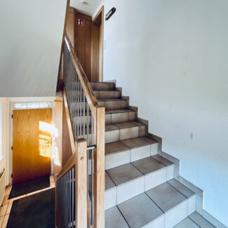 Wohn- und Geschäftshaus in Feldkirch-Altenstadt - Stiegenhaus - Amann Immobilien
