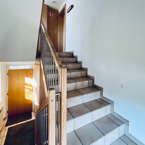 Wohn- und Geschäftshaus in Feldkirch-Altenstadt - Stiegenhaus - Amann Immobilien