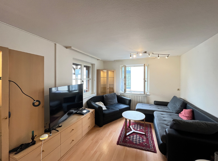 Wohn- und Geschäftshaus in Feldkirch-Altenstadt - Wohnung OG Wohnzimmer - Amann Immobilien