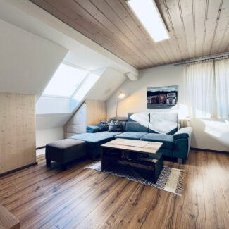 Wohn- und Geschäftshaus in Feldkirch-Altenstadt - Wohnung DG Wohnzimmer - Amann Immobilien